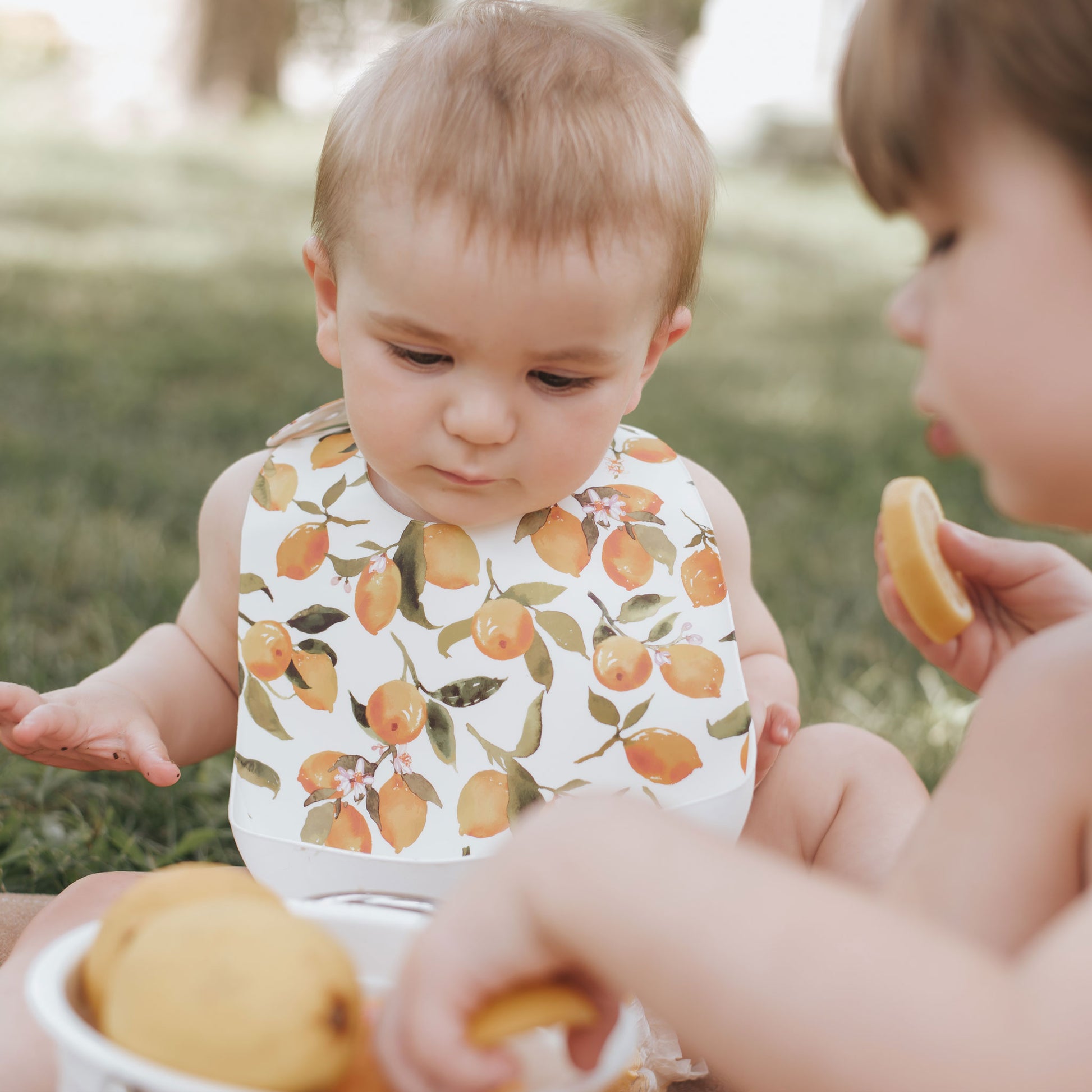 Best baby bibs, gift for baby shower, birthday, Christmas, mustard, yellow and white color with citrus, lemon, orange, peach prints, eco friendly, sustainable, silicone bibs, baby led weaning, 6 months baby essentials, starting solids, shop small, toddler must haves, neutral design for baby girl or baby boy, easy clean up