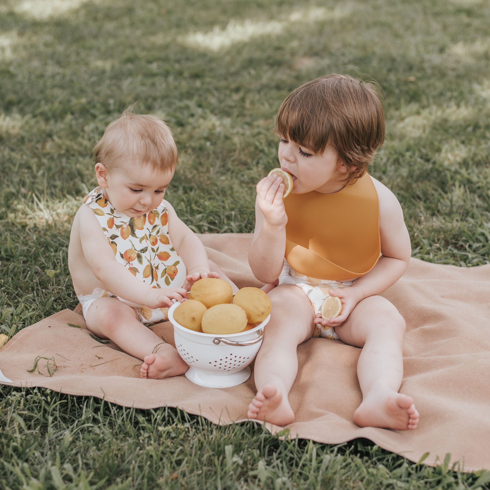 Best baby bibs, gift for baby shower, birthday, Christmas, mustard, yellow and white color with citrus, lemon, orange, peach prints, eco friendly, sustainable, silicone bibs, baby led weaning, 6 months baby essentials, starting solids, shop small, toddler must haves, neutral design for baby girl or baby boy, easy clean up