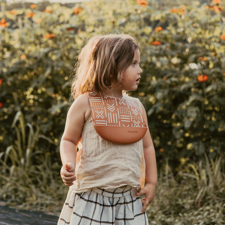 Best baby bibs, gift for baby shower, birthday, Christmas, Rust Colored, Boho Flowers in Earth Toned Colors, Eco friendly, sustainable, silicone bibs, baby led weaning, 6 months baby essentials, starting solids, shop small, toddler must haves, neutral design for baby girl or baby boy, easy clean up