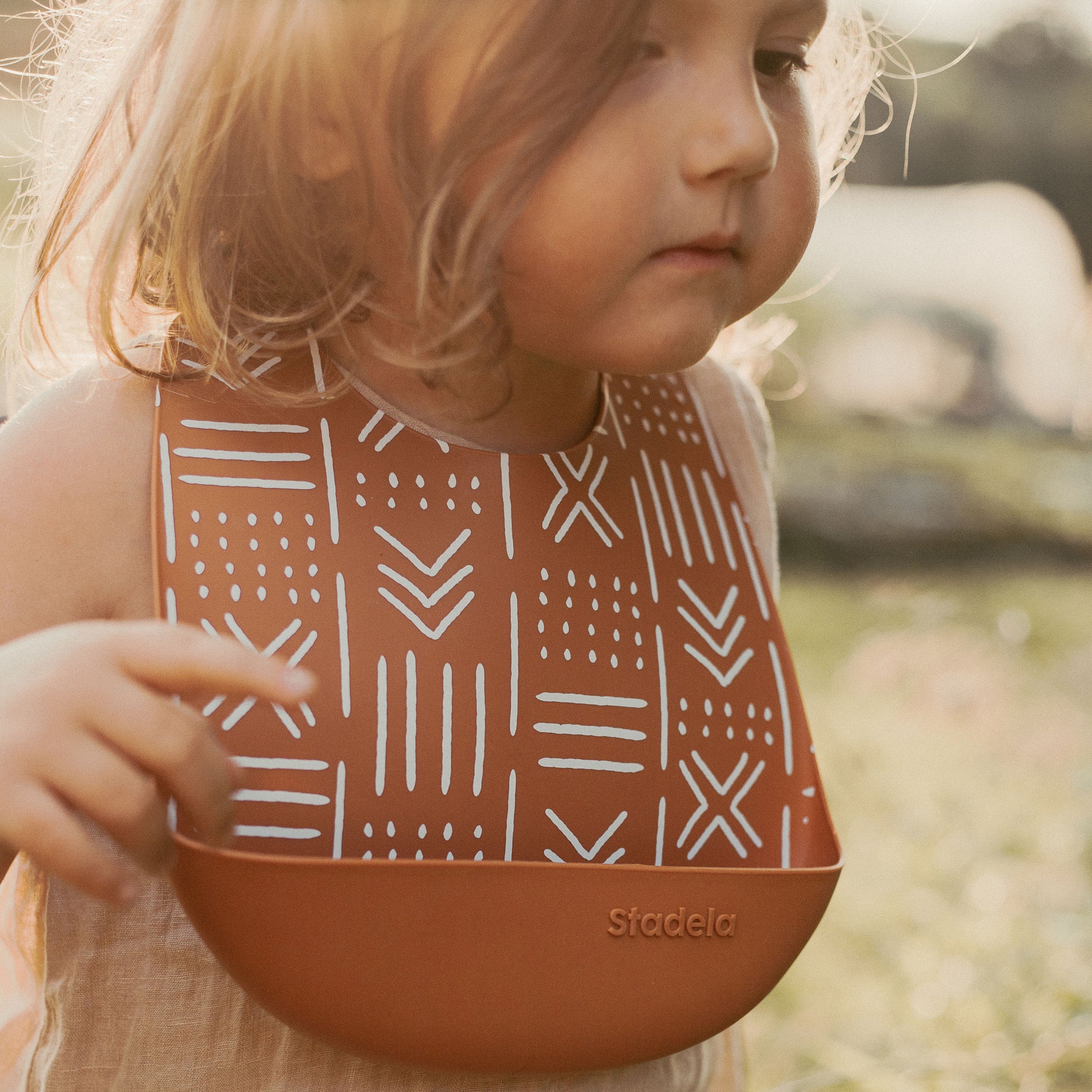 Best baby bibs, gift for baby shower, birthday, Christmas, Rust Colored, Boho Flowers in Earth Toned Colors, Eco friendly, sustainable, silicone bibs, baby led weaning, 6 months baby essentials, starting solids, shop small, toddler must haves, neutral design for baby girl or baby boy, easy clean up